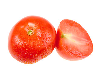 Image showing Cross and full ripe red tomatoes with dew