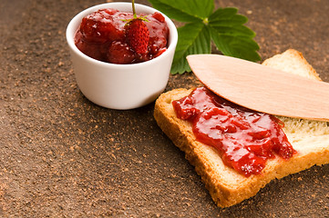 Image showing Wild strawberry jam with toast