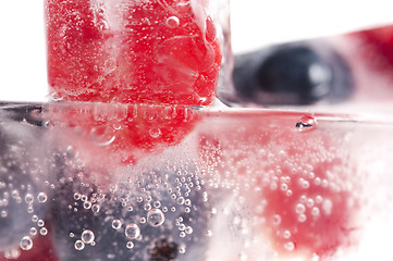 Image showing Raspberry and blackberry frozen in ice sticks