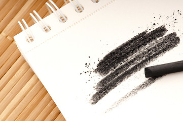 Image showing Black charcoal with smudge