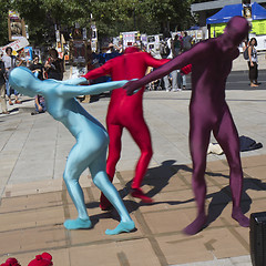 Image showing Three dancers wear zentaï
