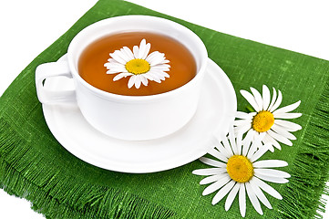 Image showing Herbal tea in a white cup with camomile