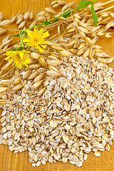 Image showing Oat flakes with yellow flowers