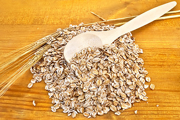 Image showing Rye flakes with a spoon
