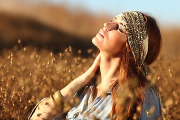 Image showing Beautiful Woman on a Field in Summertime 