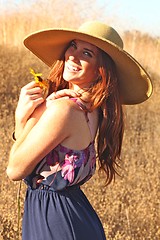 Image showing Young Beautiful Woman on a Field in Summer Time