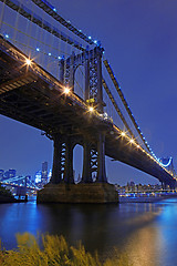 Image showing Brooklyn Bridge and Manhattan Skyline At Night NYC