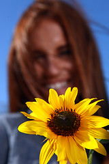 Image showing Red Haired Woman Outdoors in a Sunflower Field