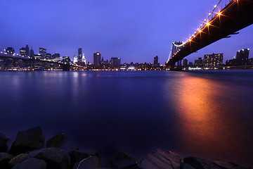 Image showing Brooklyn Bridge and Manhattan Skyline At Night NYC