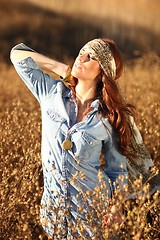 Image showing Beautiful Woman on a Field in Summertime 