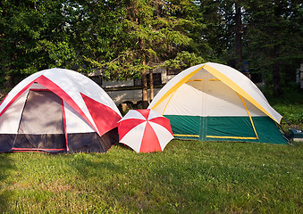 Image showing Two tents and umbrella