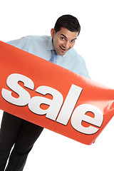Image showing Happy businesman or saleman with sale sign