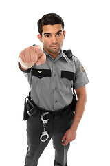 Image showing Police officer or prison guard pointing his finger