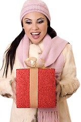 Image showing Delightful Surprise - Female holding a large red and gold gift