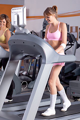 Image showing Woman on running machine in gym