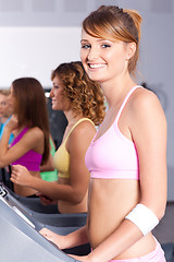 Image showing Group of women running on treadmill