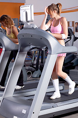 Image showing Woman on running machine in gym
