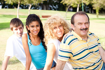 Image showing Portrait of family relaxing in park