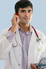 Image showing Male medical professional at work using wireless technologies