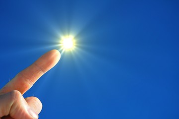 Image showing hand sun and blue sky