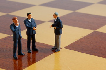 Image showing business man on a chess board