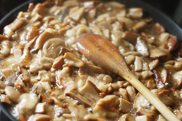 Image showing delicious fried mushrooms in a skillet 