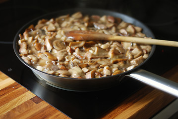Image showing delicious fried mushrooms in a skillet 