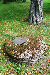 Image showing typical concrete water well with moss