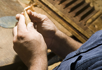 Image showing hand rolling cigar production