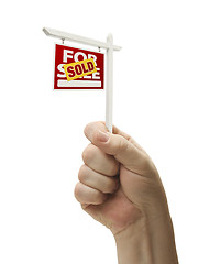 Image showing Sold For Sale Real Estate Sign In Fist On White