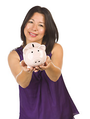 Image showing Smiling Hispanic Woman Holding Piggy Bank on White