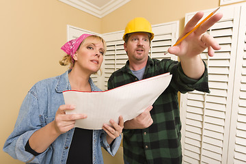 Image showing Contractor in Hard Hat Discussing Plans with Woman