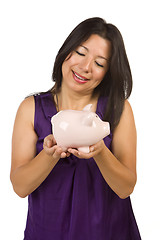 Image showing Smiling Hispanic Woman Holding Piggy Bank on White