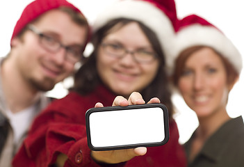 Image showing Girl with Friends and Santa Hats Holding Blank Smart Phone