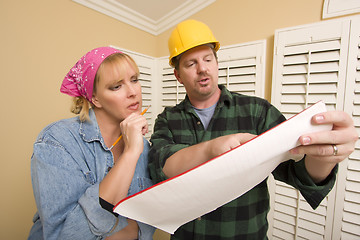 Image showing Contractor in Hard Hat Discussing Plans with Woman