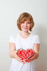 Image showing Woman with red sweets