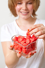 Image showing Woman with red sweets