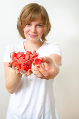 Image showing Woman with red sweets