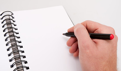 Image showing Open Notebook and Hand With Marker