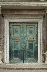 Image showing Heavy, green door in Rome