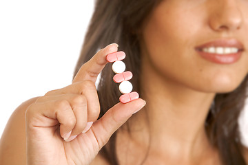 Image showing young woman with pills