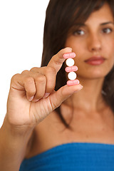 Image showing young woman with pills