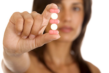 Image showing young woman with pills