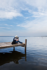 Image showing The photographer  working on the lake