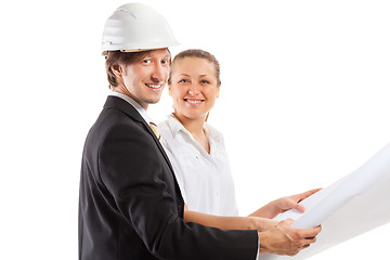 Image showing An architect wearing a hard hat and co-worker