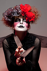 Image showing woman mime with knife