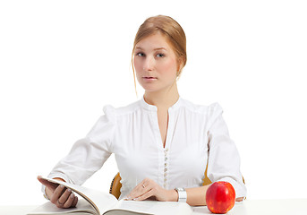 Image showing woman with apple and book