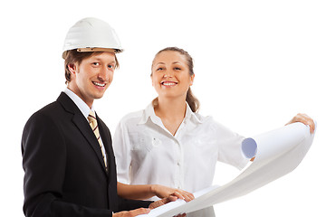 Image showing An architect wearing a hard hat and co-worker