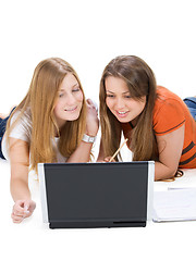 Image showing two young happy student girl work on laptop