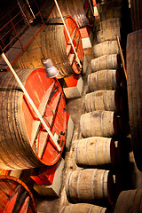 Image showing wine barrels in a winery, France